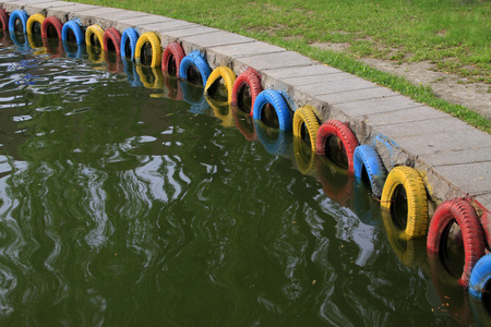 color tyres by the river in a park, closeup of photoの写真素材