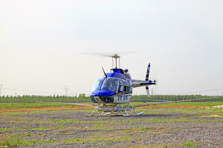 TANGSHAN - JUNE 13: spraying pesticide helicopter to start, on june 13, 2014, Tangshan city, Hebei Province, China
 のeditorial素材