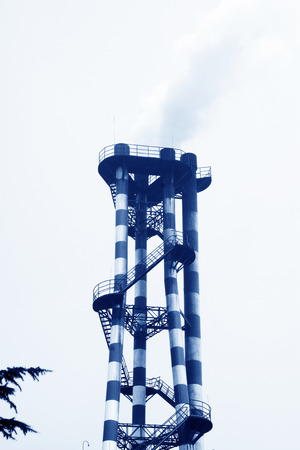 Heavy industry factory chimneys and pipeline, closeup of photoの写真素材