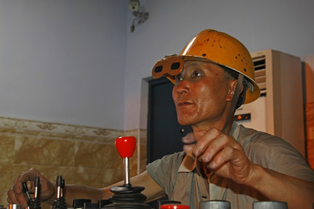 TANGSHAN - JUNE 14: observers in steel plant operation room on June 14, 2014, Tangshan city, Hebei...