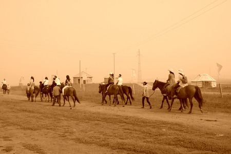 WULANBUTONG GRASSLAND - JULY 19: Travelers on horseback in the WuLanBuTong grassland on July 19, 2014, Inner Mongolia autonomous region, China. 
のeditorial素材