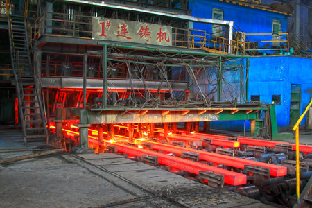 hot steel ingot in a production workshop, closeup of photoのeditorial素材