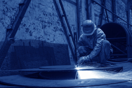 TANGSHAN - JUNE 19: workers cutting the steel plate in the workshop, on June 19, 2014, Tangshan...