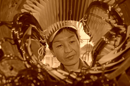 TANGSHAN - JUNE 19: Women workers repairing electrical machine in a factory, on June 19, 2014, Tangshan city, Hebei Province, Chinaのeditorial素材