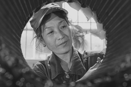 TANGSHAN - JUNE 20: Women workers repairing electrical machine in a factory, on June 20, 2014, Tangshan city, Hebei Province, China
のeditorial素材