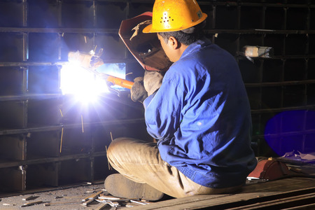 TANGSHAN CITY - JUNE 20: Worker welding parts in the production workshop, on June 20, 2014, Tangshan city, Hebei Province, China
のeditorial素材