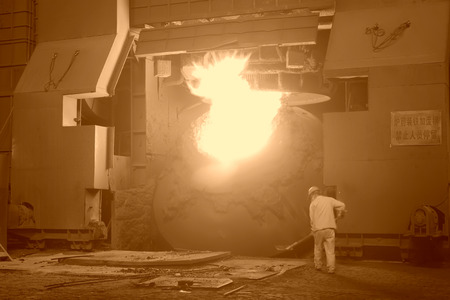 TANGSHAN - JUNE 19: steel mills converter workers tense work, on June 19, 2014, Tangshan city, Hebei Province, Chinaのeditorial素材