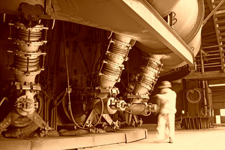 TANGSHAN - JUNE 19: workers operating blast furnace equipment, on June 19, 2014, Tangshan city, Hebei Province, Chinaのeditorial素材
