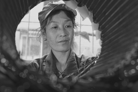 TANGSHAN - JUNE 20: Women workers repairing electrical machine in a factory, on June 20, 2014, Tangshan city, Hebei Province, China
のeditorial素材
