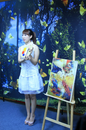 TANGSHAN CITY - AUGUST 22: Painting model in a commercial activity in a shop, on august 22, 2014, Tangshan City, Hebei Province, China 
のeditorial素材