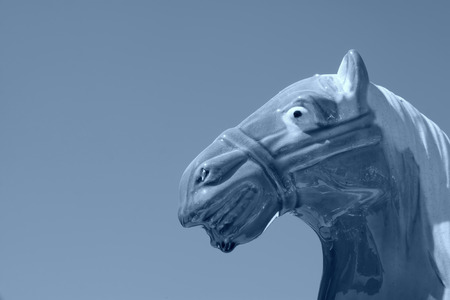 Ceramic horsehead under the blue sky, closeup of photoの写真素材