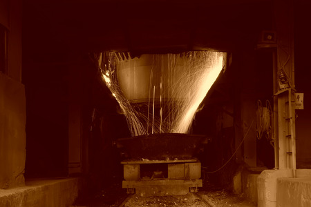 steelmaking converter dumping steel slag in a factory, closeup of photo