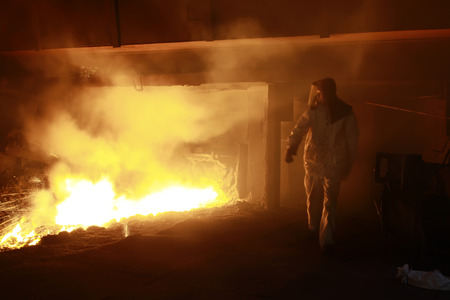 hot molten iron flowing from blast furnace, closeup of photoのeditorial素材