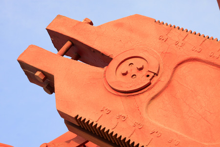 Beam pumping unit crank, closeup of photoの写真素材