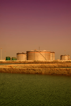 CAOFEIDIAN CITY - SEPTEMBER 27: China's oil storage tanks jidong oilfield company, on september 27, 2014, Caofeidian City, Hebei Province, Chinaのeditorial素材