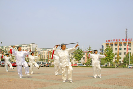 LUANNAN COUNTY - SEPTEMBER 20: Old women Fencing performance in a square on September 20, 2014,...