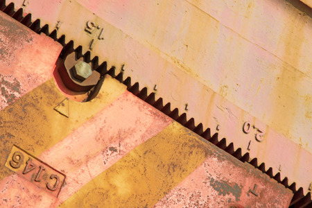 teeth scale on beam pumping unit crank pulley, closeup of photoのeditorial素材