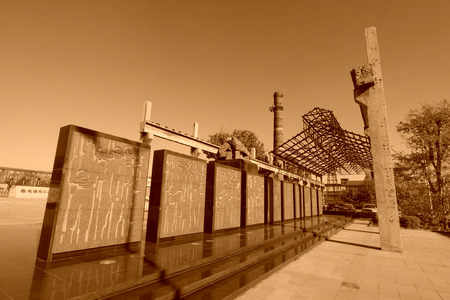 TANGSHAN - NOVEMBER 4: The stele, chimney and abandoned factories framework in the kailuan national mine park on november 4, 2013, tangshan city, hebei province, China.のeditorial素材