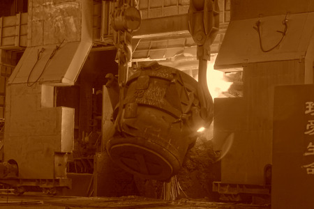 steel mills converter filling materials, closeup of photo