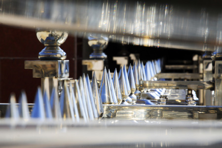 Stainless steel metal parts, closeup of photoの写真素材