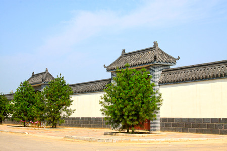 LUANNAN COUNTY - AUGUST 7: traditional Chinese architectural style gate house and walls in the countryside,  on august 7, 2014, Luannan County, Hebei Province, China.のeditorial素材