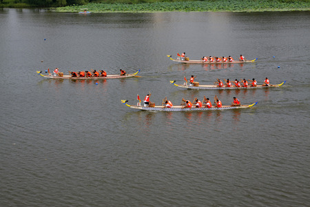 LUANNAN COUNTY - AUGUST 8: dragon boat race scene in the river on august 8, 2014, Luannan County,...