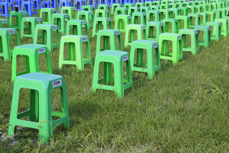 Plastic stools on the bushes at parkのeditorial素材