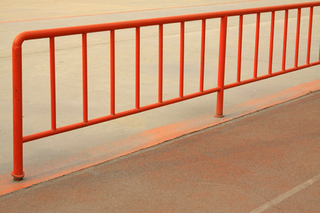 Orange metal railings, closeup photo