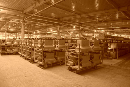 LUANNAN COUNTY - JANUARY 5: The ceramic semi-finished products parts on the iron frame, in the ZhongTong Ceramics Co., Ltd. January 5, 2014, Luannan county, Hebei Province, China.のeditorial素材