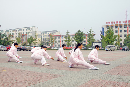 LUANNAN COUNTY - SEPTEMBER 20: Old people practicing martial art at the square on September 20, 2014, Luannan county, Hebei Province, Chinaのeditorial素材