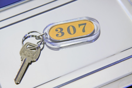 Key card in the stainless steel plate, closeup of photoの写真素材