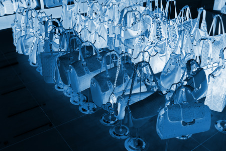 TANGSHAN - NOVEMBER 16: Ms color bag were put on the shelf in a store, on November 16, 2013, tangshan city, hebei province, China.のeditorial素材