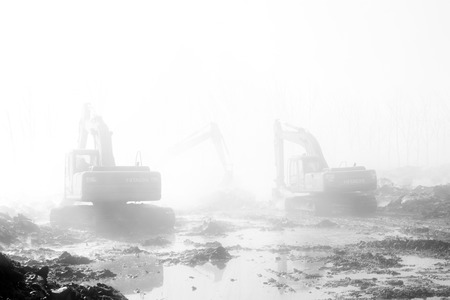TANGSHAN - NOVEMBER 20: The excavators were clearing up rubbish after fire, November 20, 2013, tangshan city, hebei province, China.のeditorial素材