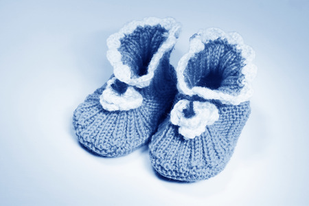 wool woven children's shoes on white background, closeup of photoの写真素材