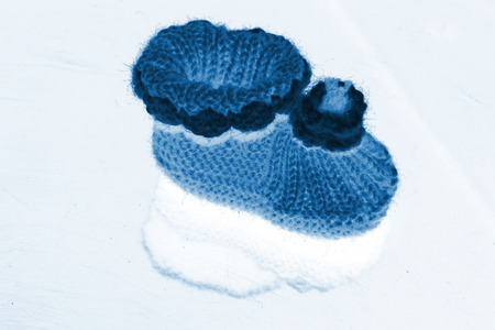 wool woven children's shoes on white background, closeup of photoの写真素材