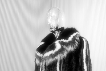 alloy mannequin wearing black fur clothing, closeup photoの写真素材