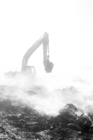 TANGSHAN - NOVEMBER 20: The excavators were clearing up rubbish after fire, November 20, 2013, tangshan city, hebei province, China.のeditorial素材