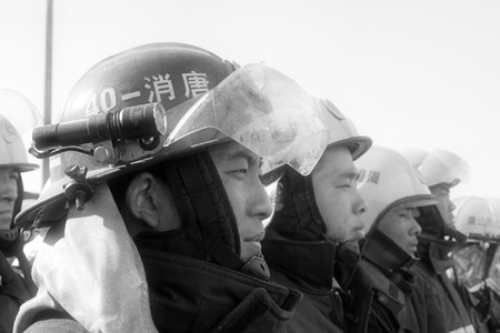 TANGSHAN - NOVEMBER 20: The firemen preparing to leave the fire scene after the fire, November 20, 2013, tangshan city, hebei province, China.のeditorial素材
