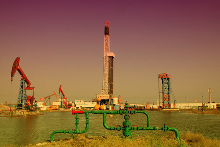 CAOFEIDIAN - SEPTEMBER 27: crank balanced beam pumping unit in the JiDong oilfield, on September 27, 2014, Caofeidian City, hebei province, China.のeditorial素材