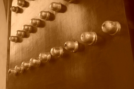 copper nail decoration on the door, closeup of photoの写真素材
