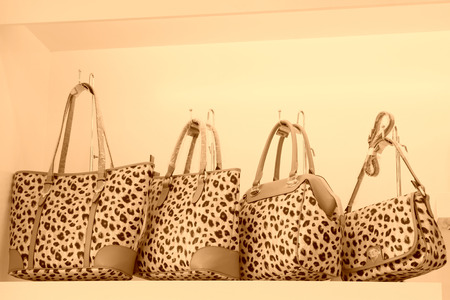 TANGSHAN - NOVEMBER 16: Ms color bag were put on the shelf in a store, on November 16, 2013, tangshan city, hebei province, China.のeditorial素材