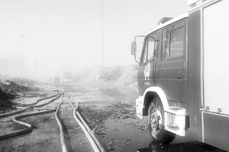 TANGSHAN - NOVEMBER 20: The prepare to leave the scene of the fire fighting vehicles and personnel after the fire, November 20, 2013, tangshan city, hebei province, China.のeditorial素材