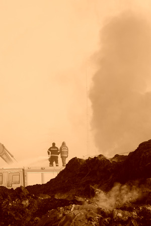 TANGSHAN - NOVEMBER 20: firefighters in sprinkler at the scene of the fire, November 20, 2013, tangshan city, hebei province, China.のeditorial素材