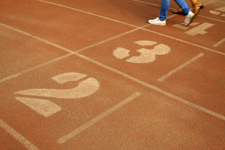 green number on plastic runway in a sports ground in a middle schoolの写真素材