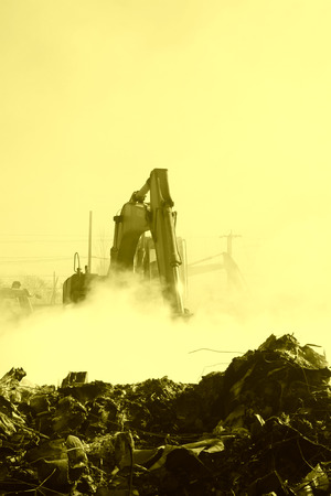 TANGSHAN - NOVEMBER 20: The excavators were clearing up rubbish after fire, November 20, 2013, tangshan city, hebei province, China.のeditorial素材