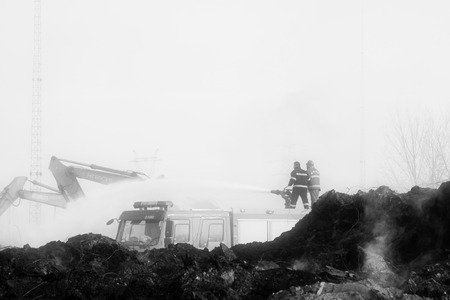 TANGSHAN - NOVEMBER 20: firefighters in sprinkler at the scene of the fire, November 20, 2013,...