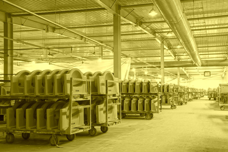 LUANNAN COUNTY - JANUARY 5: The ceramic semi-finished products parts on the iron frame, in the ZhongTong Ceramics Co., Ltd. January 5, 2014, Luannan county, Hebei Province, China.のeditorial素材