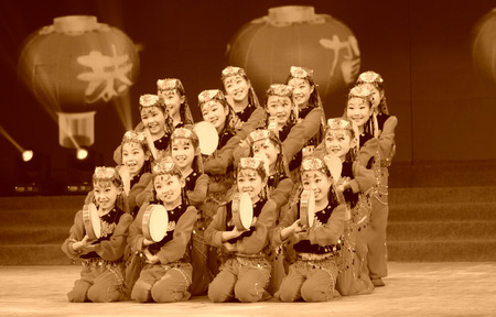 TANGSHAN - JANUARY 26: The children hand drum dance performances on the stage, on January 26, 2014, tangshan, china.のeditorial素材