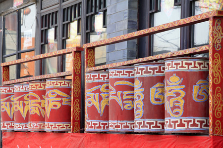 Tibetan rotatable design in a temple, closeup of photoの写真素材