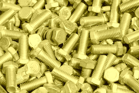 bolts piled up together, closeup of photo